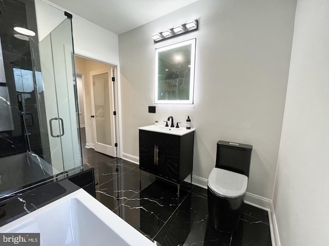 bathroom with vanity, a shower with shower door, and toilet