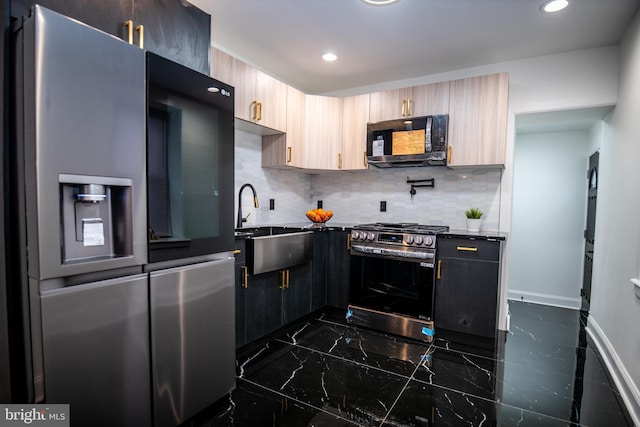 kitchen featuring stainless steel appliances, sink, light brown cabinets, and backsplash