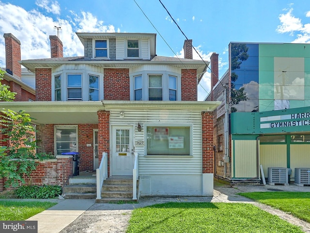 view of front of home featuring central AC unit