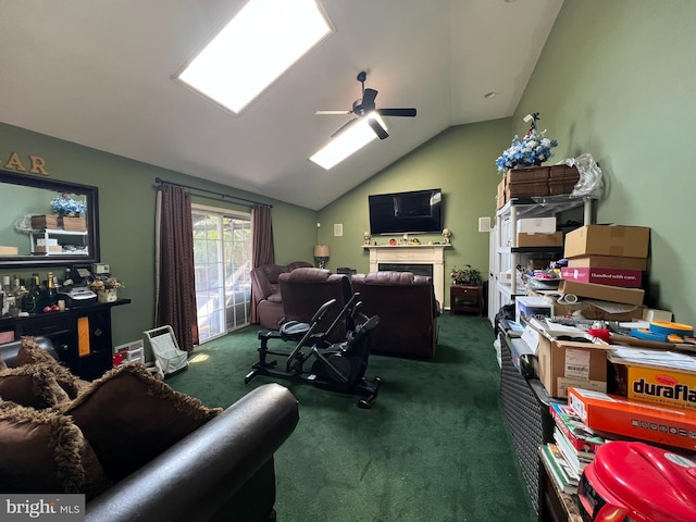 office space featuring dark colored carpet, vaulted ceiling, and ceiling fan