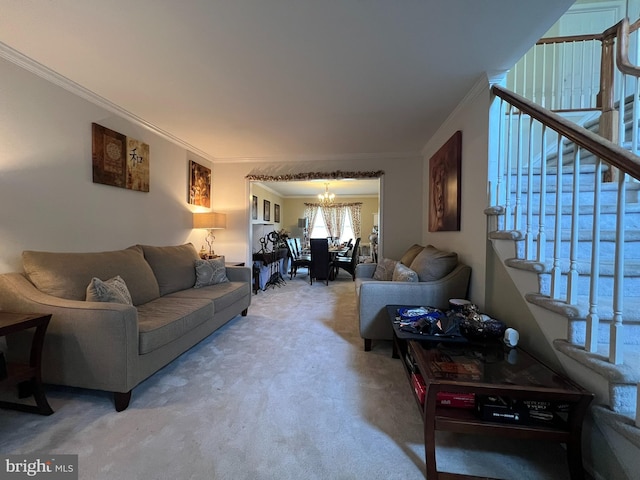 living room with ornamental molding, carpet, and a chandelier