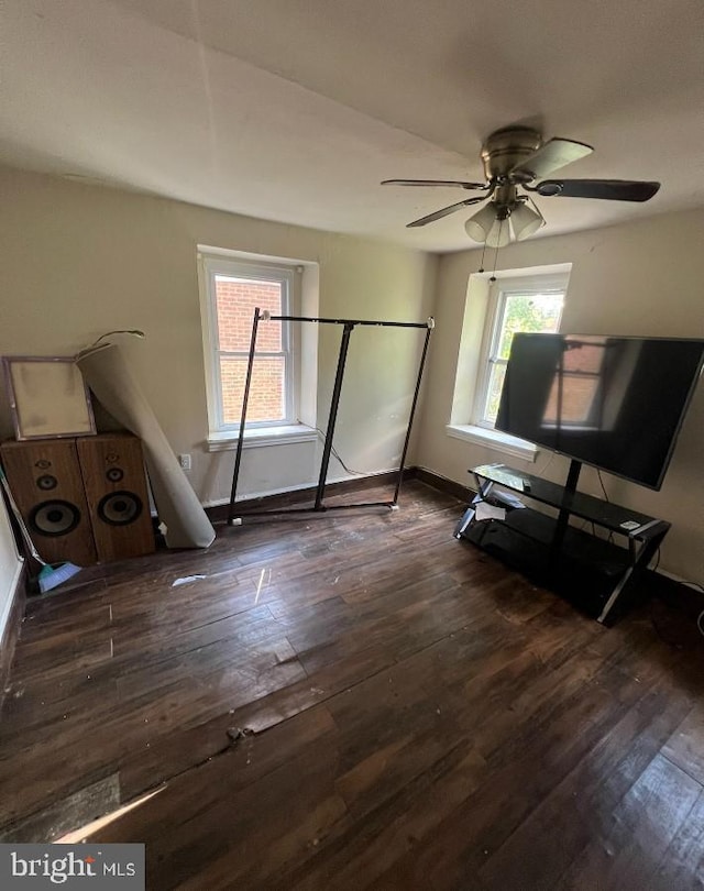 bedroom with ceiling fan and dark hardwood / wood-style flooring