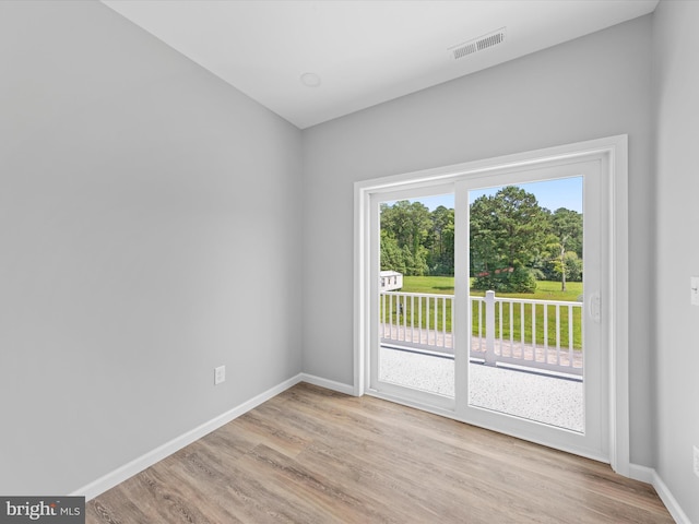 spare room featuring light wood-type flooring