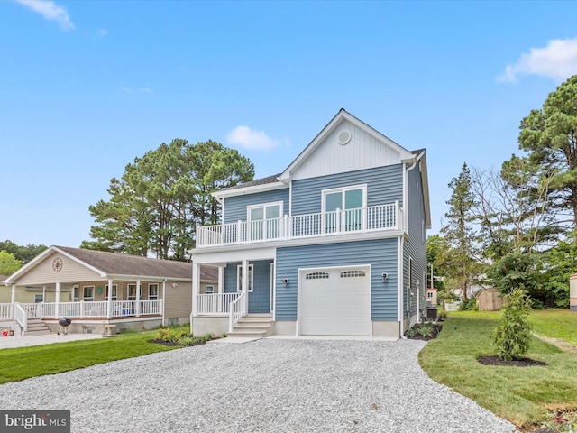 view of front of house with a garage, a porch, cooling unit, and a front yard