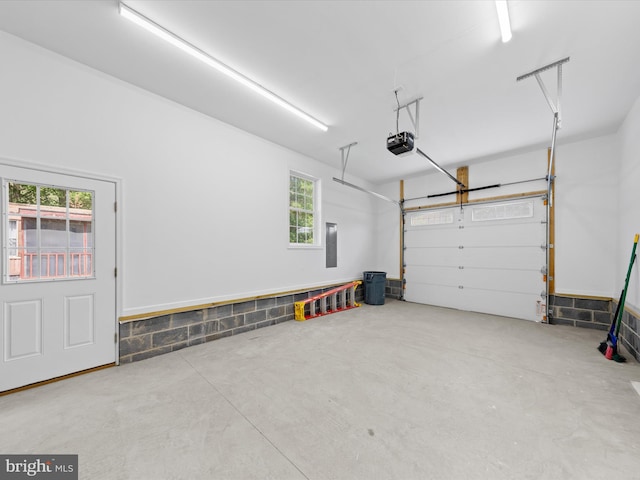 garage featuring a garage door opener and electric panel