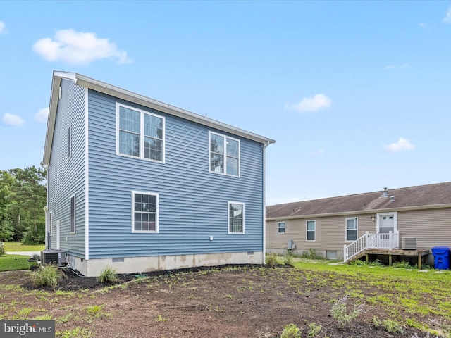 rear view of property with central air condition unit