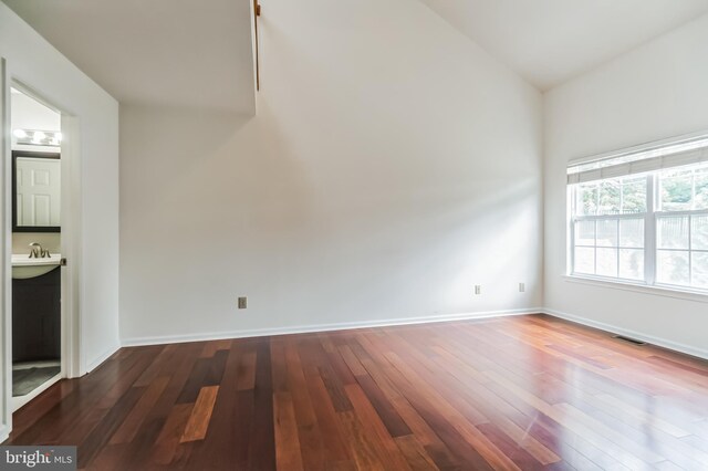 interior space featuring hardwood / wood-style flooring and lofted ceiling