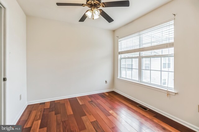 empty room featuring wood-type flooring and ceiling fan