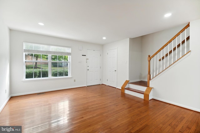 foyer entrance with hardwood / wood-style floors