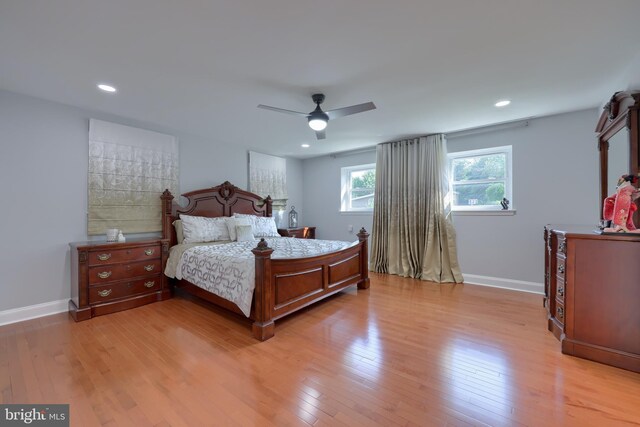 bedroom featuring light wood-type flooring and ceiling fan