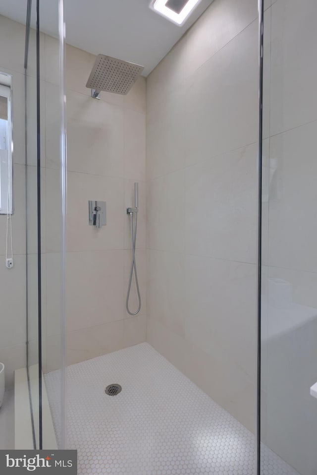 bathroom featuring an enclosed shower