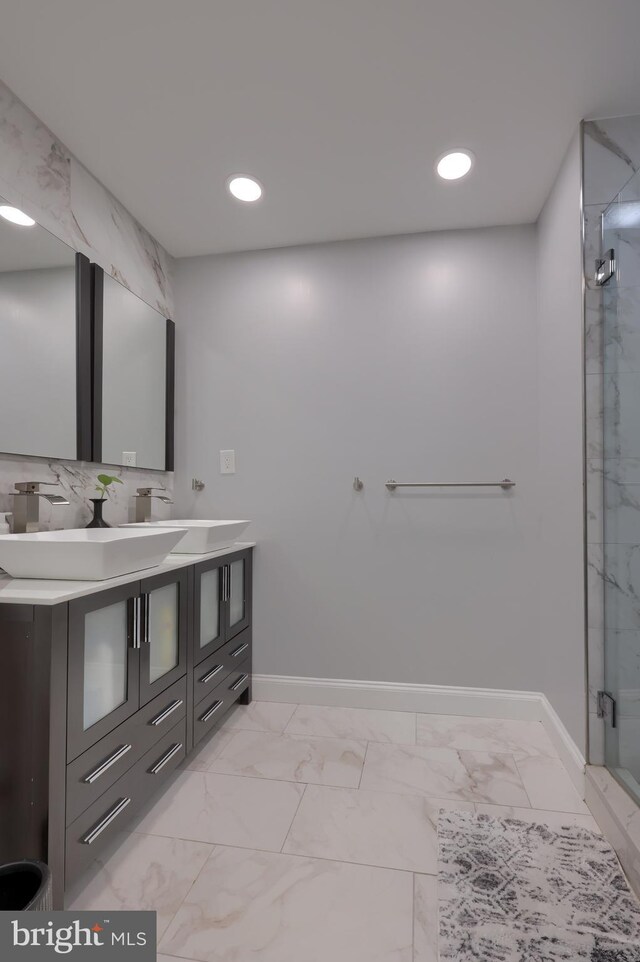 bathroom featuring vanity, tile patterned floors, and an enclosed shower