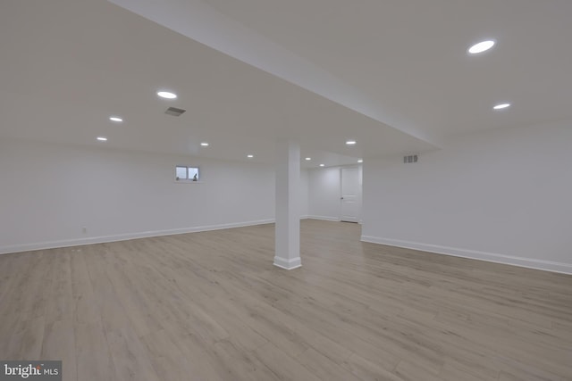 basement featuring light wood-type flooring