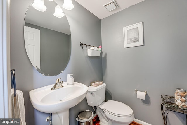 bathroom featuring sink and toilet