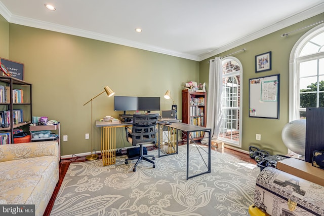 office space with crown molding and light wood-type flooring