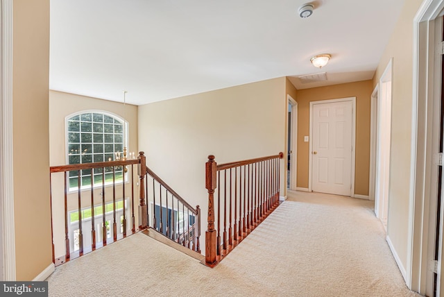 corridor with light carpet