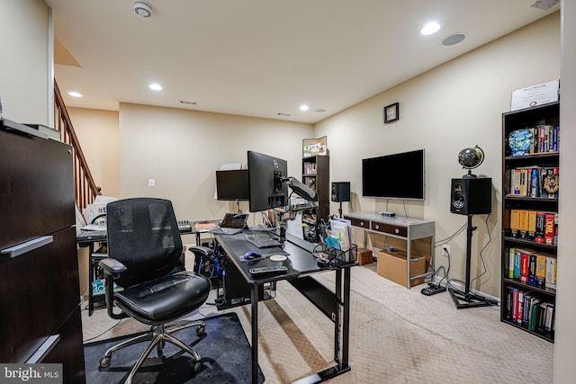 office area featuring light colored carpet