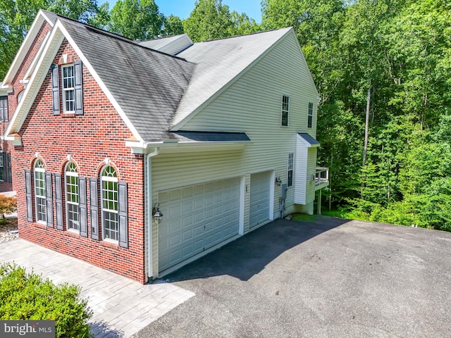 view of side of property with a garage