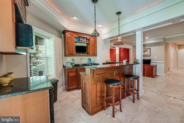 bar with pendant lighting, dark stone counters, crown molding, and sink