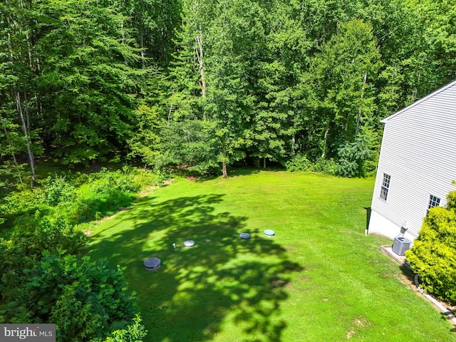 view of yard featuring central AC