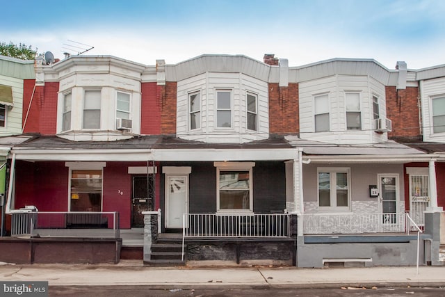 multi unit property with a porch and cooling unit