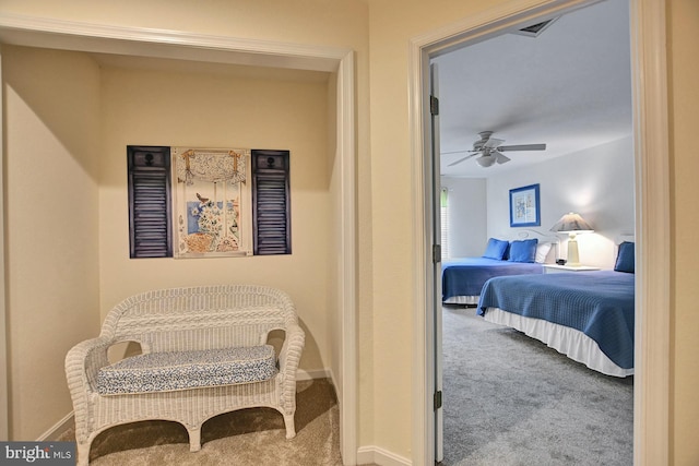 carpeted bedroom featuring visible vents, ceiling fan, and baseboards