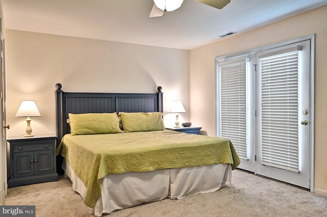 bedroom featuring access to outside, a ceiling fan, visible vents, and light colored carpet