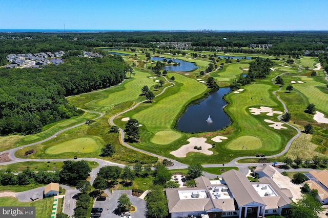 aerial view with view of golf course and a water view