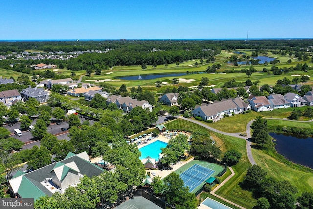 bird's eye view featuring a residential view, view of golf course, and a water view