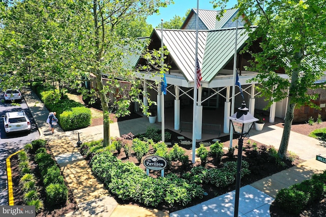 view of home's exterior featuring a standing seam roof and metal roof