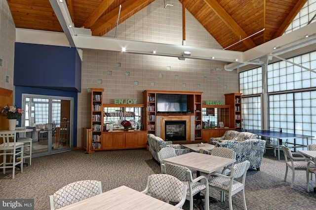 dining room featuring high vaulted ceiling, beam ceiling, carpet, and wood ceiling