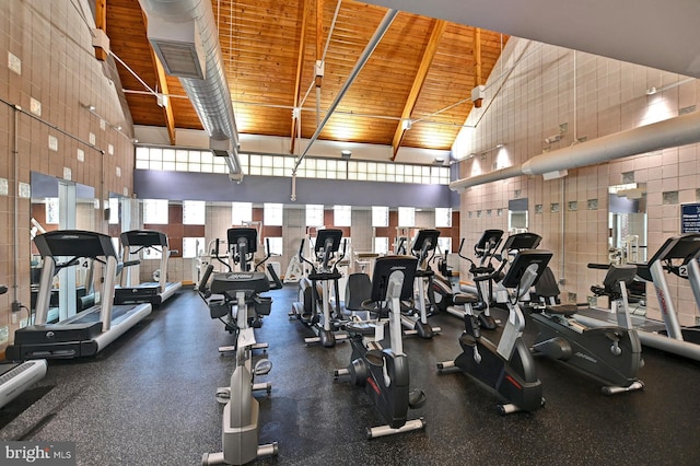 workout area with high vaulted ceiling, wooden ceiling, and visible vents