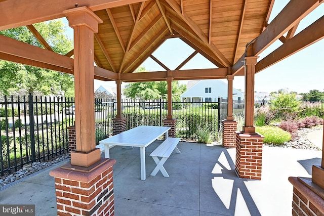 view of patio with fence and a gazebo