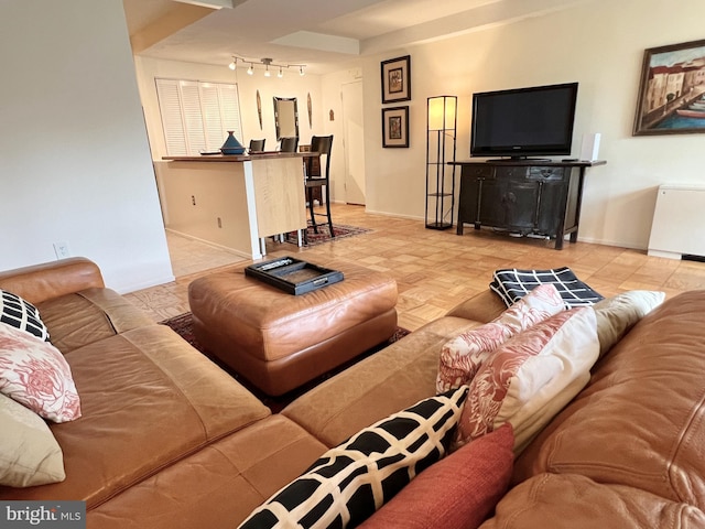 living room featuring track lighting