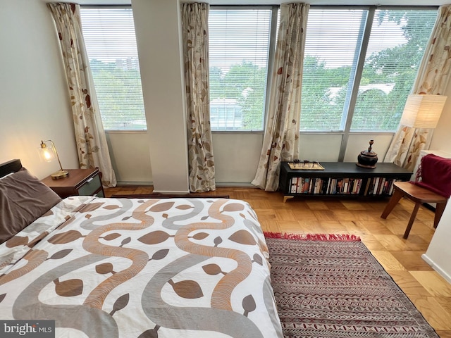 bedroom with multiple windows