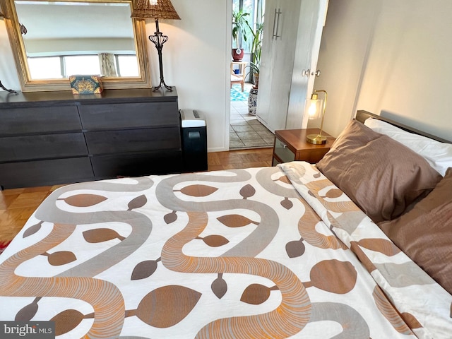 bedroom with light wood-type flooring