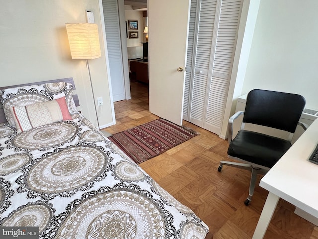 bedroom with light parquet floors