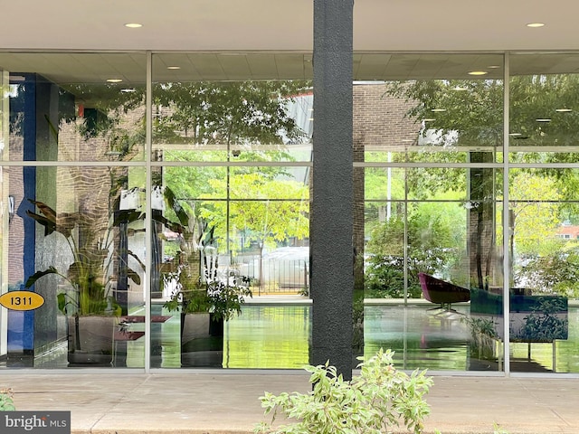 property entrance featuring brick siding