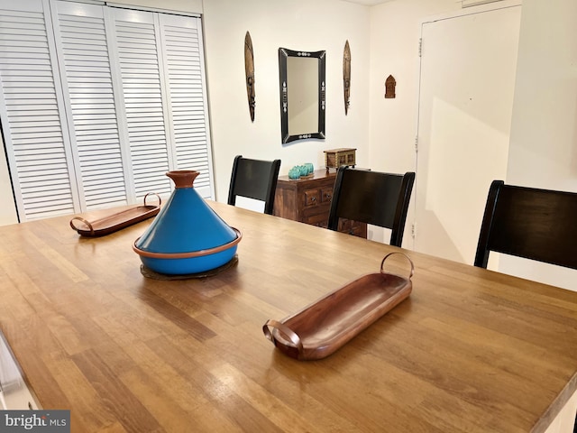 dining area with wood-type flooring