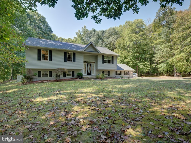 raised ranch featuring a front lawn