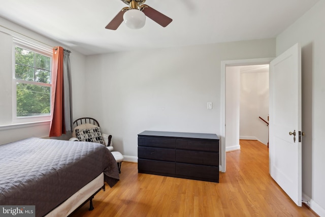 bedroom featuring light hardwood / wood-style flooring and ceiling fan