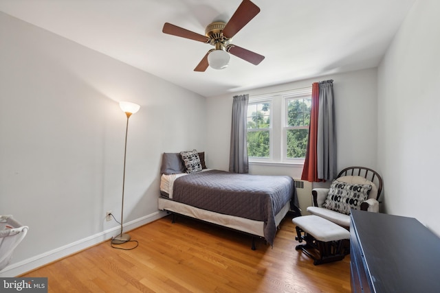 bedroom featuring ceiling fan and wood-type flooring