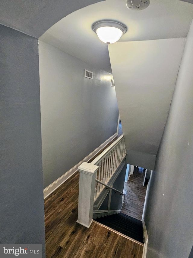 stairs with hardwood / wood-style flooring