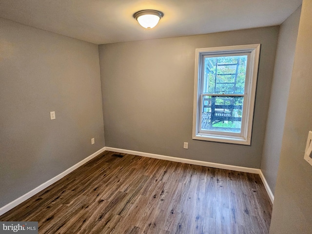 empty room featuring wood-type flooring