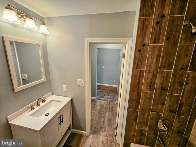 bathroom featuring vanity and hardwood / wood-style flooring