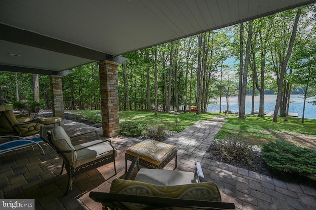 view of patio with a water view