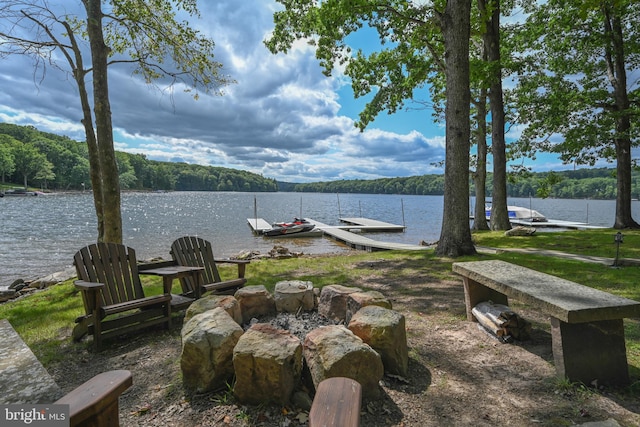 exterior space featuring a water view and a dock