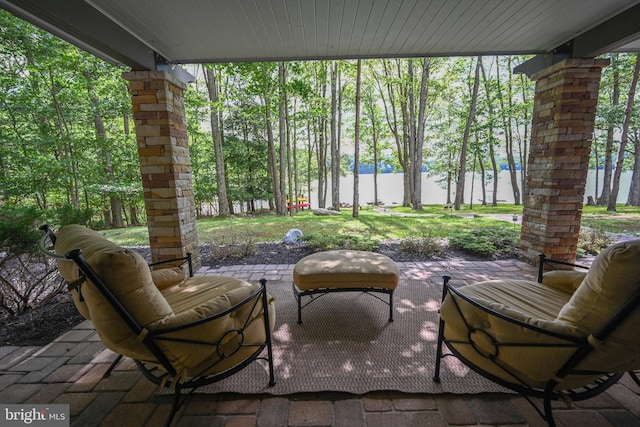 view of patio featuring a water view