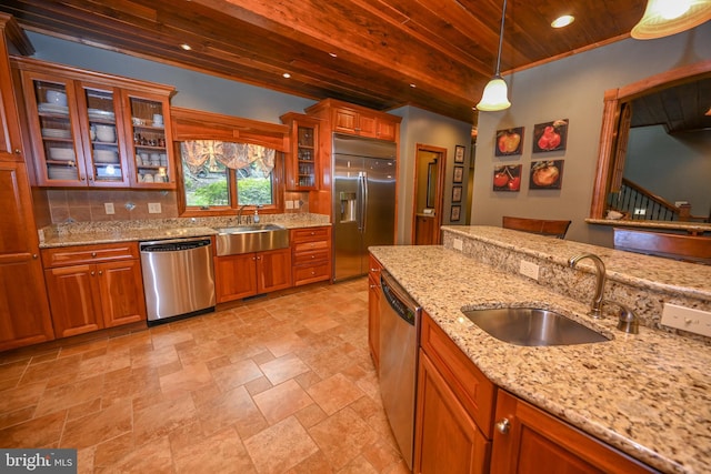 kitchen featuring wood ceiling, glass insert cabinets, stainless steel appliances, pendant lighting, and a sink