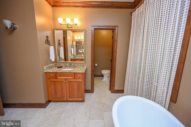 full bathroom featuring ornamental molding, vanity, toilet, and tile patterned floors